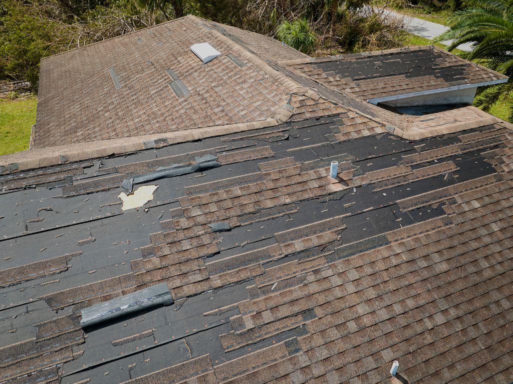 Broken Roof that needs Roof Repair and Roof Replacement
