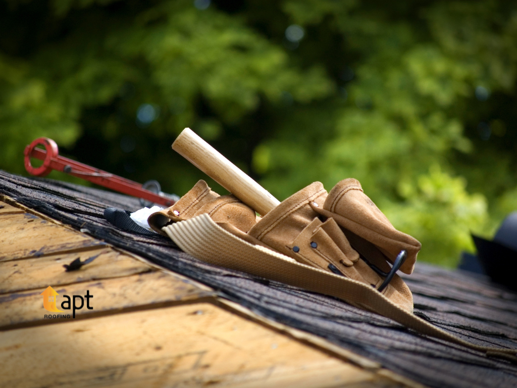 Damaged metal roof flashing around a residential roof penetration showing gaps in the roofing junction.
